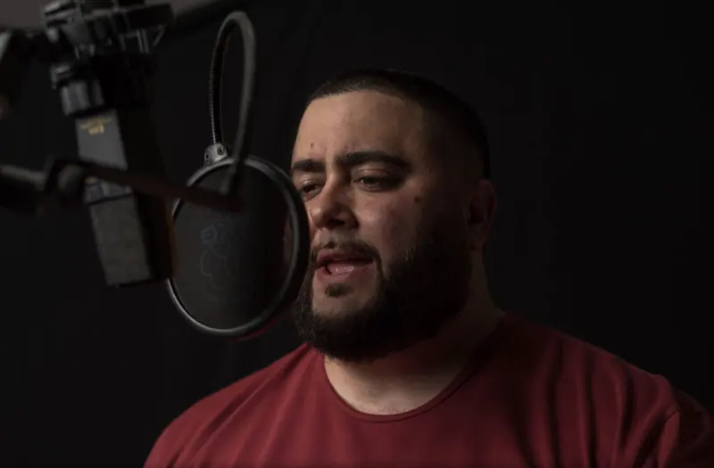 MC Solar Wind at the mic behind a pop filter
